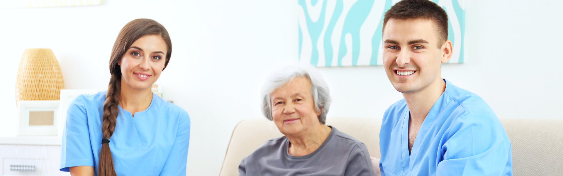 nurses and elderly woman smiling