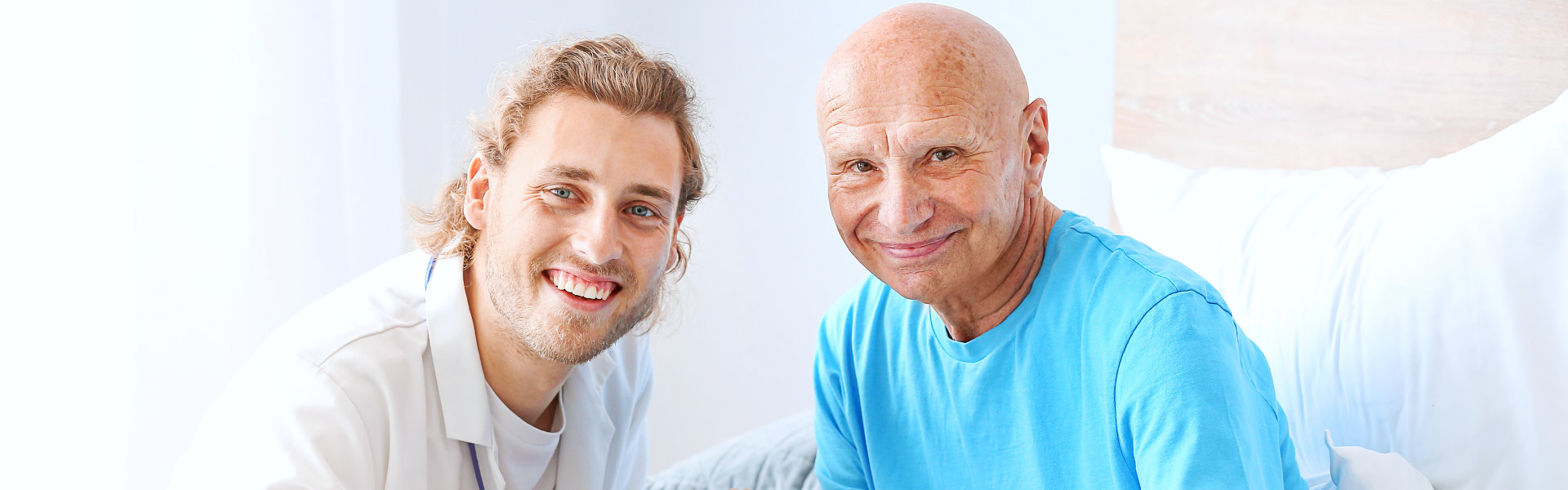 doctor and elderly man smiling