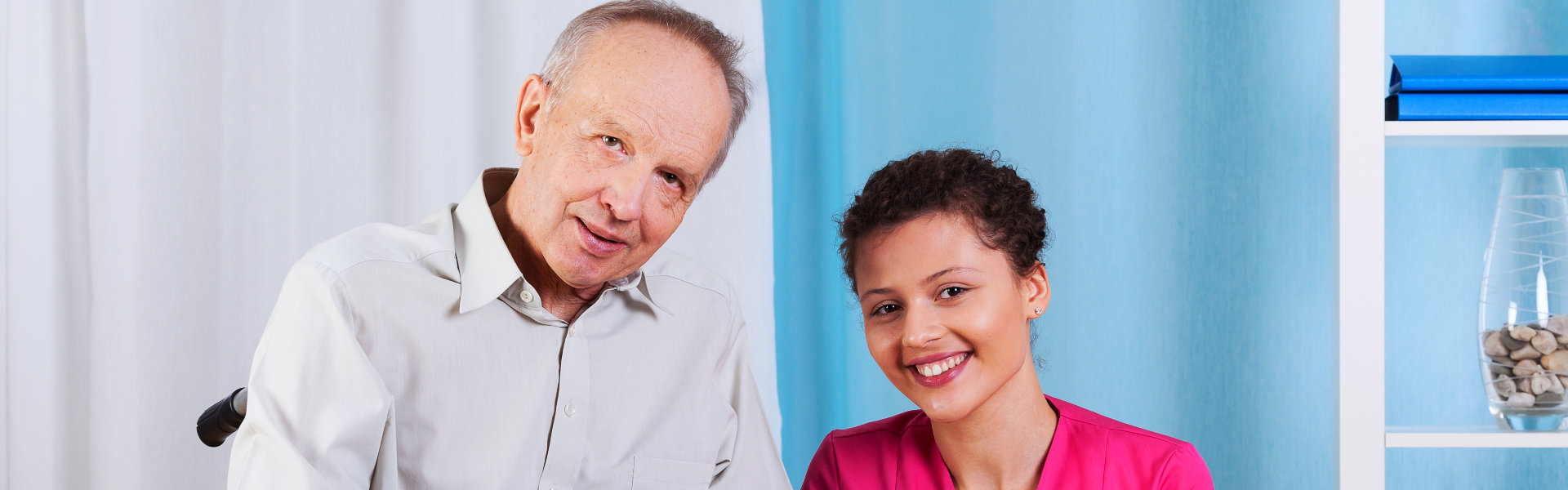 nurse and elderly man smiling